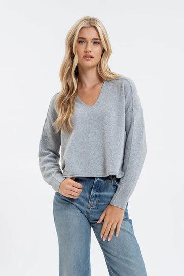 EXPOSED SEAM SPLIT NECK KNIT SWEATER